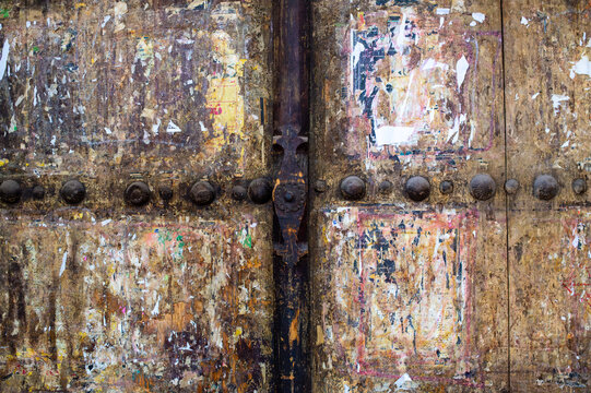 Detail of an Ancient Weathered Wooden Door with Iron Studs, Iran