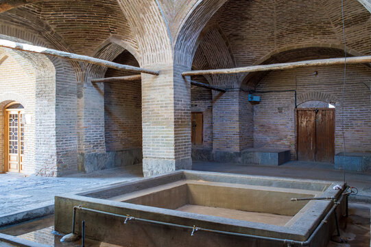 Ablution hall with stone pool at the Shah Mosque