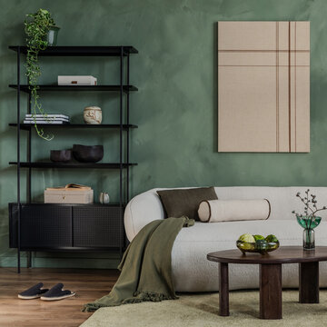 Modern living room interior with white sofa, black shelf, green wall, and minimalist abstract art canvas for home decor and design project