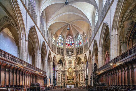 Toulouse Cathedral in Toulouse, France, interior view facing the altar. Gothic style architecture with stained glass windows