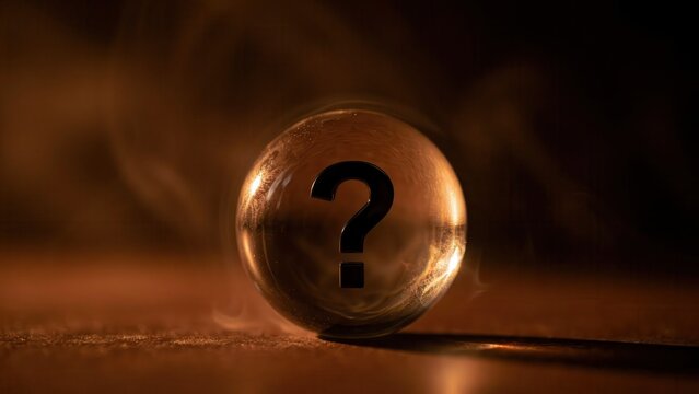 A mysterious black question mark centered inside a crystal sphere with moody warm lighting. This is a conceptual image for solving problems and finding answers.