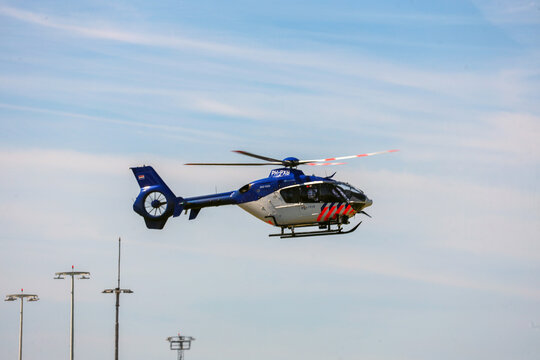 Police helicopter is landing at Rotterdam The Hague Airport