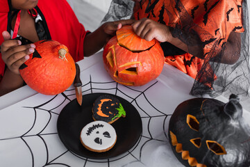 Fototapeta premium Creating spooky memories with Halloween pumpkins and treats on a festive autumn day