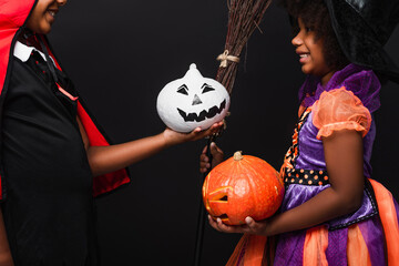 Fototapeta premium Children enjoy Halloween activities while showing off their creative costumes and treats