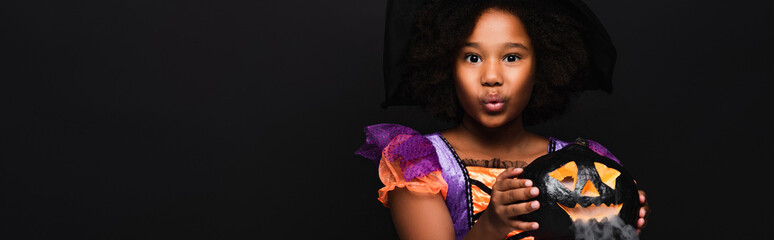 Fototapeta premium Little girl in vibrant Halloween costume brings joy and excitement to the spooky season