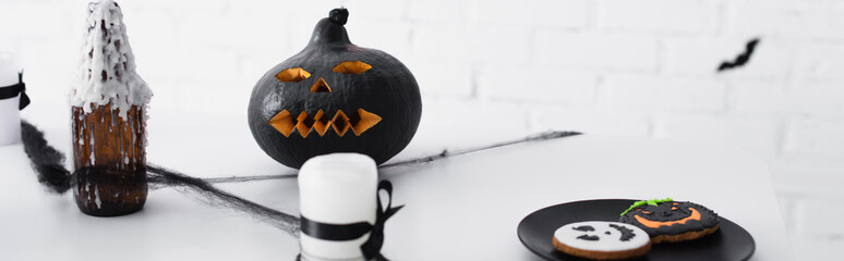 Fototapeta premium Vibrant Halloween decor with spooky treats and playful pumpkin designs