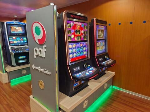 Helsinki, Finland-Nov.30th 2025: Paf branded slot machines and electronic gambling devices inside a ferry casino.