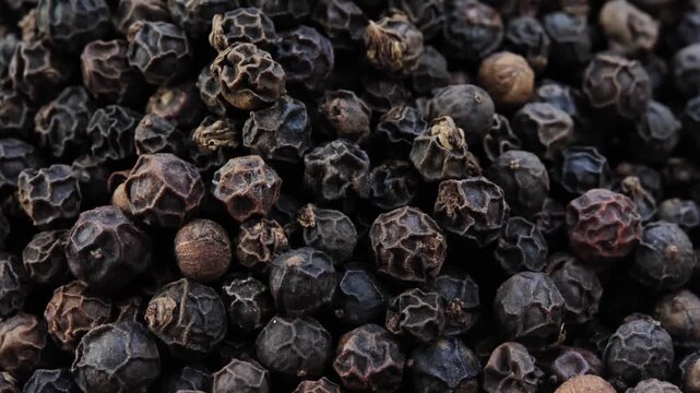 Black peppercorns in a bowl
