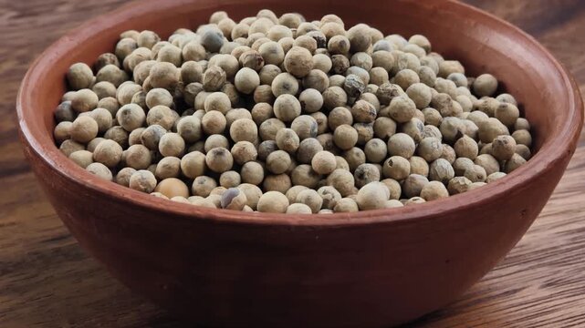 White peppercorns in a bowl
