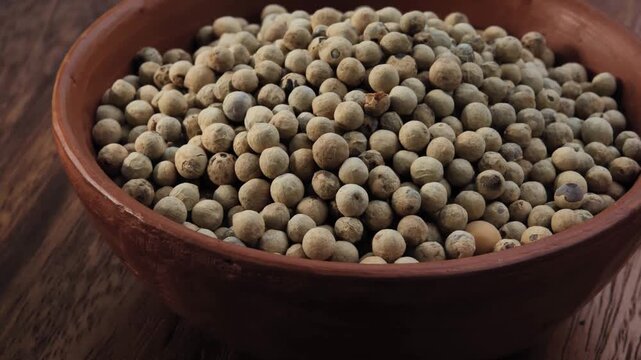 White peppercorns in a bowl
