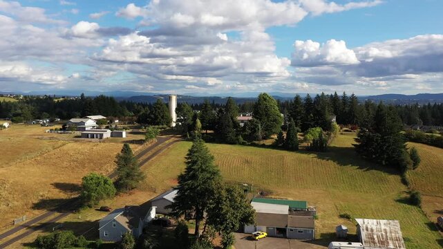 4K aerial drone footage of suburban neighborhood and residential housing in Camas, Washington, USA, showing single family homes, curved streets, real estate development and community layout