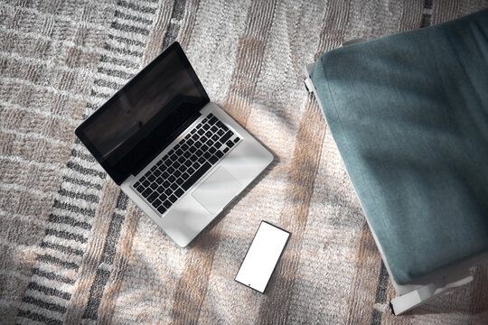Smartphone and laptop at home &ndash; remote work, online communication and digital lifestyle.