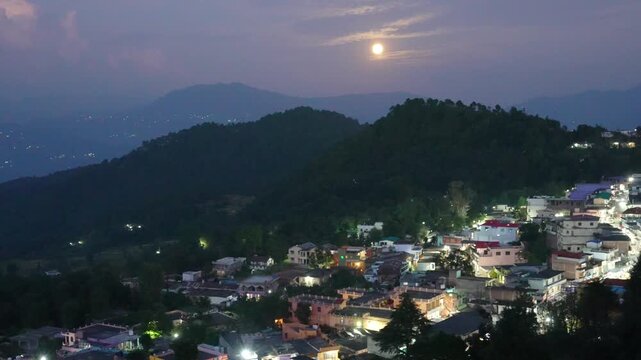 Low Sun Over Illuminated Berinag Hill Town and Layered Kumaon Ridges, Uttarakhand