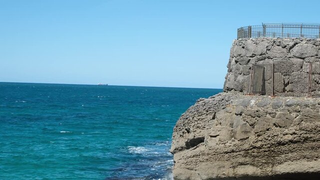 Minimalist coastal enclosure at Parque Marino de la Magdalena, Santander, Spain. Copy space.
