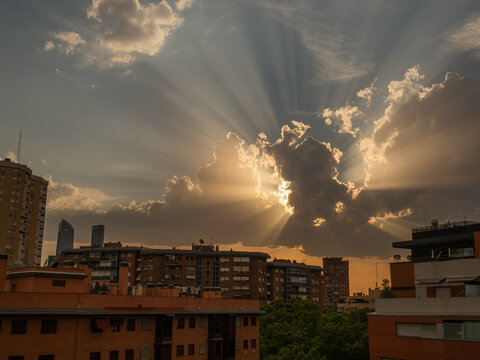 Crepuscular rays over city 