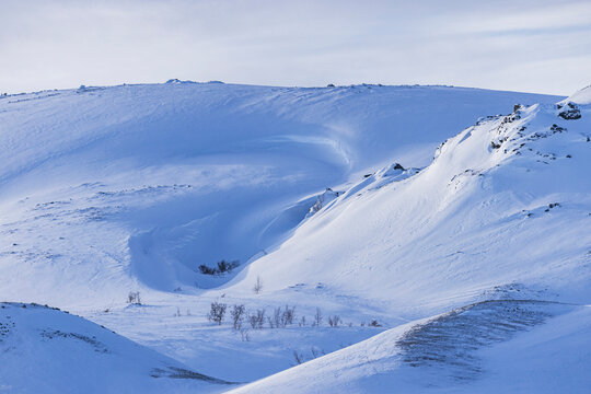 Snow-Covered Arctic Fell Landscape in Blue Winter Light