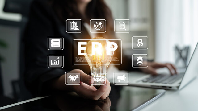 A business professional holds a glowing light bulb representing innovative ideas, surrounded by icons illustrating ERP systems, showcasing efficiency and modern corporate strategy. Ledger