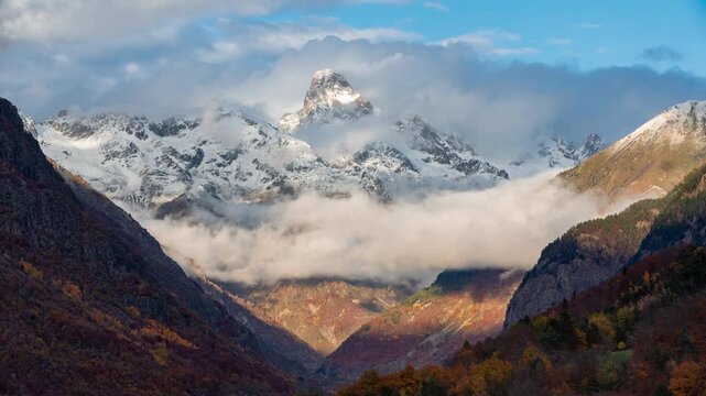 Timelapse of clouds drifting around Olan peak at sunset above the Valgaudemar Valley in autumn. Ecrins National Park in Hautes-Alpes, French Alps, France