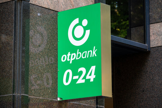 Budapest, Hungary &mdash; OTP Bank 0-24 customer service sign displayed on the exterior of a bank building.