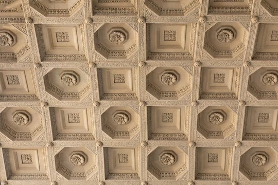 Ancient Roman-inspired coffered ceiling detail with geometric relief pattern