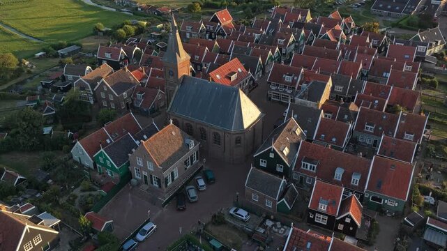 Aerial view flying over marken village netherlands at sunset