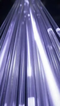 Fiber Optic Strands Glowing and Converging in a Dynamic, Abstract Light Animation. Seamless Looping Footage for Digital Backgrounds.