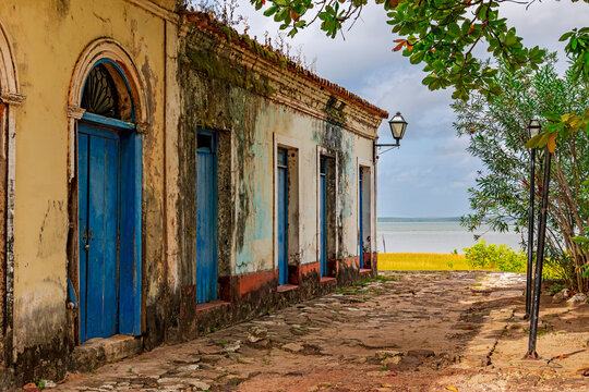 Historic houses weathered by time facing the sea in Alcantara, Maranhao.