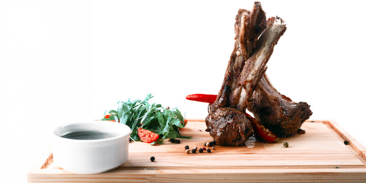Grilled Lamb Chops On Wooden Board