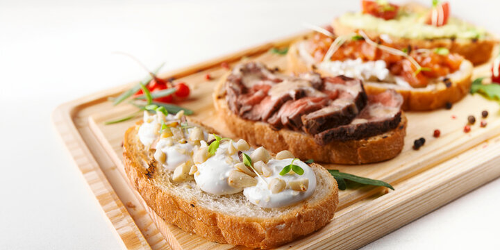 Gourmet bruschetta assortment on wooden board