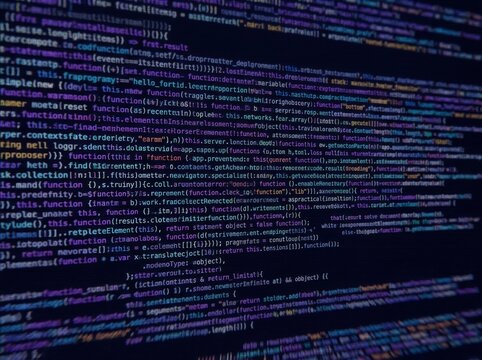 Bright, multicolored text of computer code on a dark screen background, showcasing programming language structure.