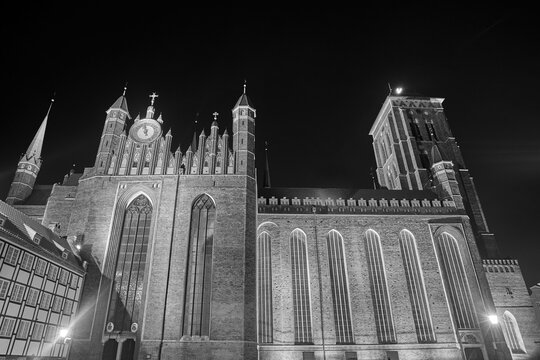 Gothic, brick Co-Cathedral Basilica of the Assumption of the Blessed Virgin Mary in Gdansk, illuminated at night