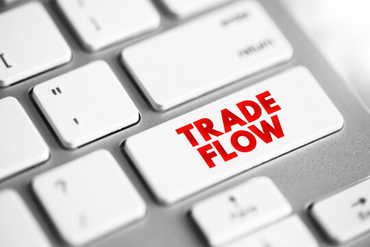 TRADE FLOW text displayed on a modern computer button. This conceptual photo illustrates the rapid advancement of modern economic markets and the dynamic transformation of global business systems.