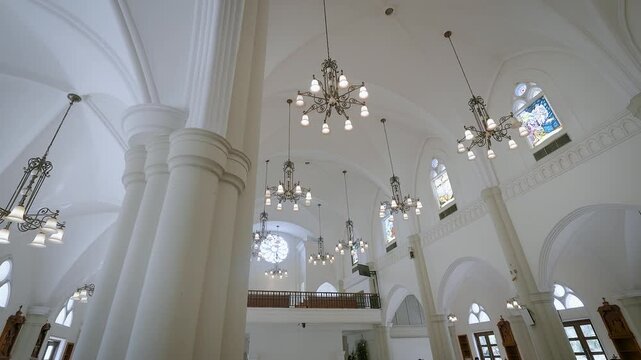Pendant lights serve as an elegant touch that enhances the grandeur of the church interior.