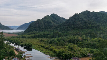 Fototapeta premium Aerial close-up of green forested mountain ridges