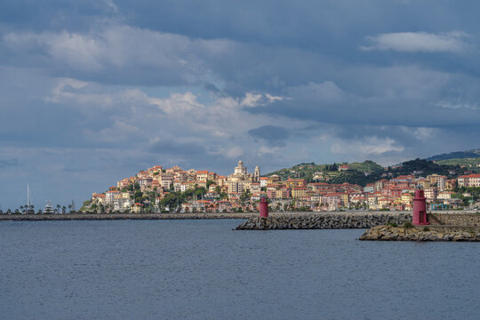 Clouds over coastal city. Imperia, Liguria Region, Italy