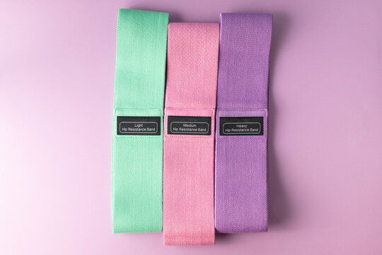 Woven fabric, elastic exercise resistance bands for hips in three stretch strengths