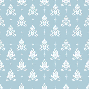 Damask floral pattern with vintage motifs on a soft blue background, designed for wallpaper, fabric and textile applications in elegant retro interiors.