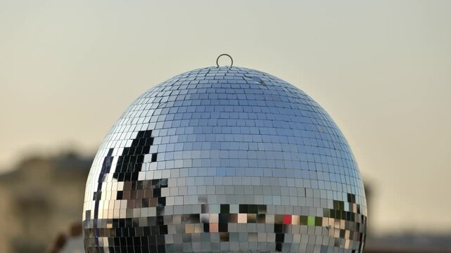 Disco ball reflecting light, symbolizing celebration, party, and festive entertainment