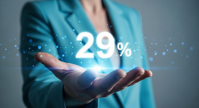 Businesswoman holding a glowing 29 percent sign representing financial growth and data