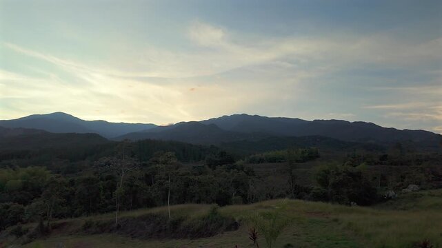 serene sunset over colombian mountains and rural landscape