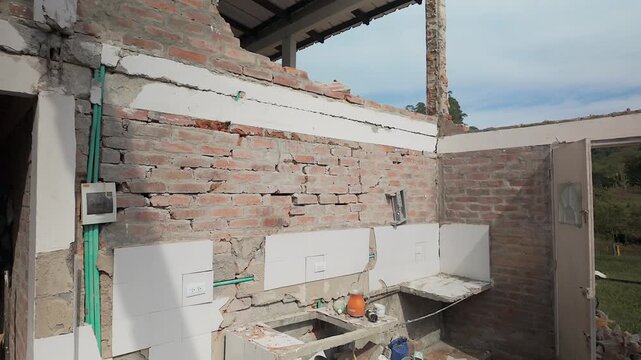 damaged kitchen and broken walls after colombia earthquake