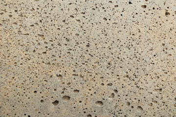 texture di superficie di cemento vecchio e poroso e di colore bianco tendente al giallo © PhotoMet