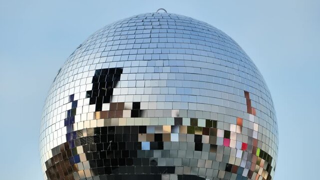 Disco ball reflecting light, symbolizing celebration, party, music, and nightlife
