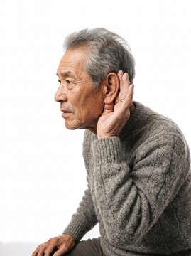 Elderly Asian Man With Gray Hair Cupping Ear To Listen Carefully Against White Background