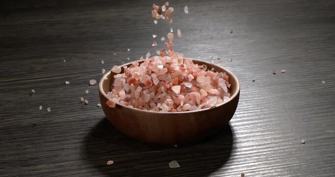 Himalayan pink salt in a super slow motion, natural mineral seasoning for healthy cooking and spa concepts. Super slow motion 1500 fps.
