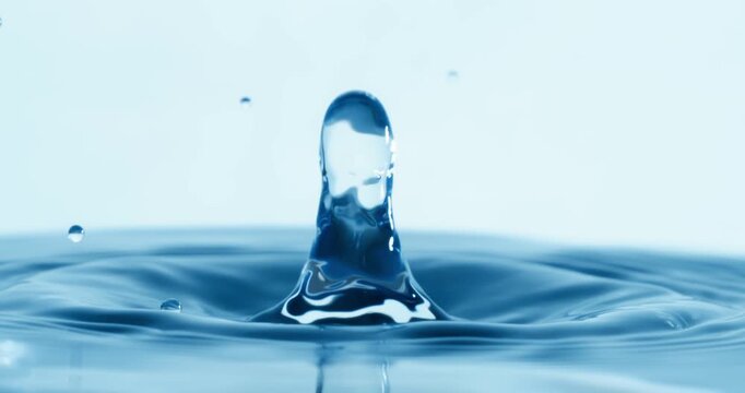 Drop of water falls into a drop of water in a super slow motion. Shot on super slow motion 1600 fps.