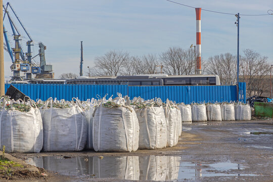 Broken Glass Bottles in White Sacks Material for Recycling Facility