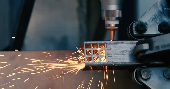 CNC Laser cutting of metal, modern industrial technology Making Industrial Details. Shot on super slow motion camera 1000 fps.