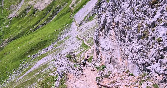 Hikers crossing rocky alpine terrain on the Gatterl route