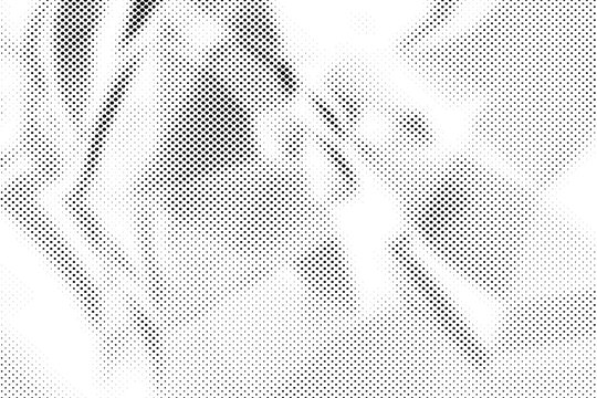 Abstract black and white halftone pattern background with grainy textured dots and high contrast geometric design